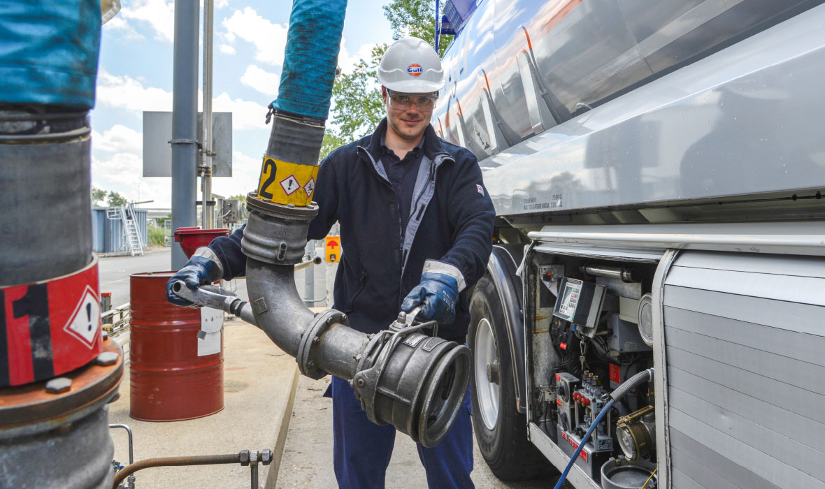 Gulf employee with oil tanker